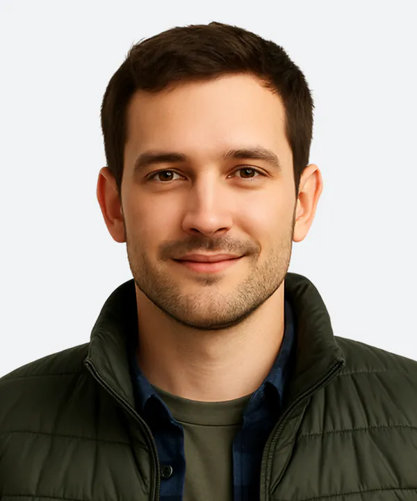 A professional headshot of a MEES Compliance team member and energy efficiency assessor.